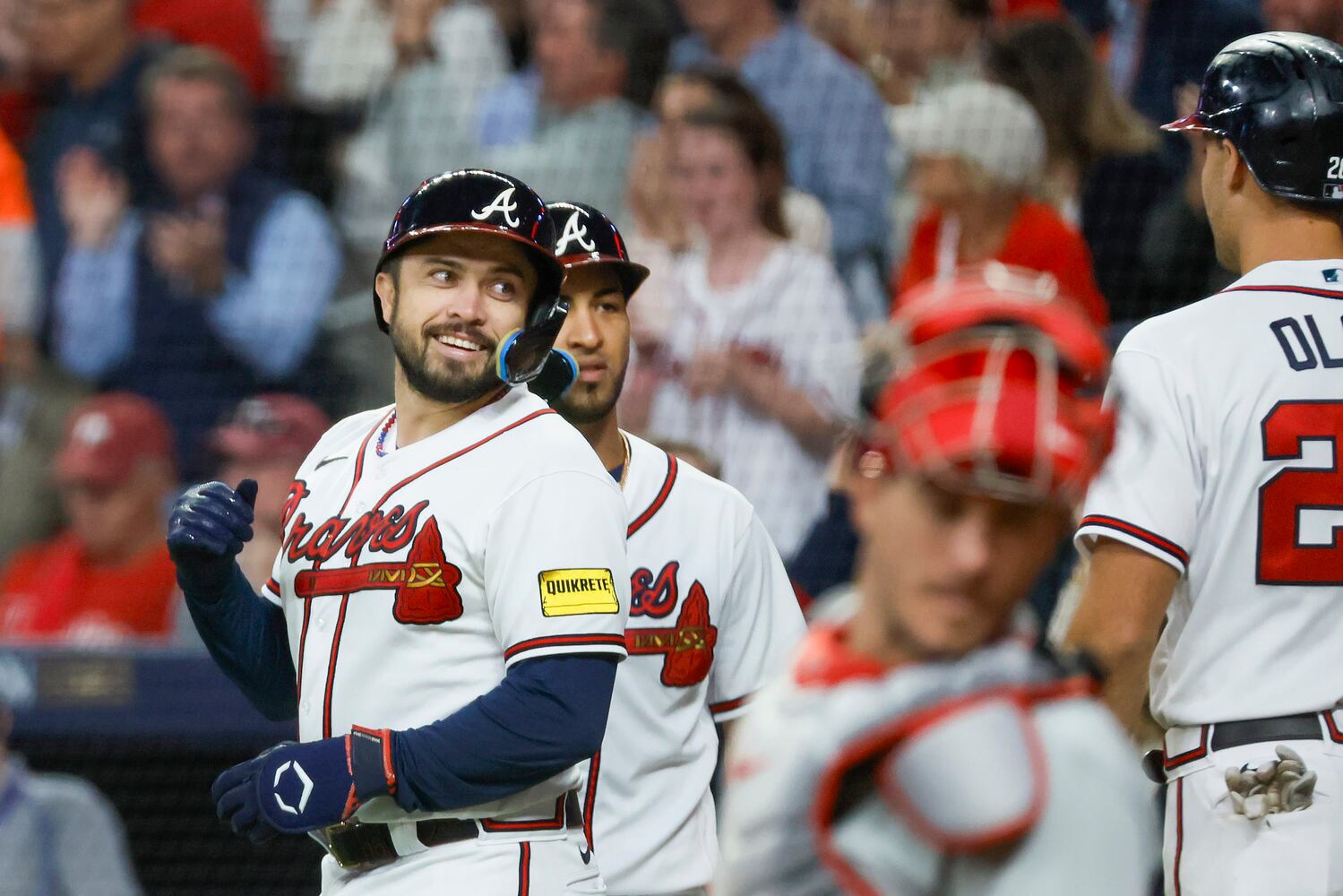 Atlanta Braves’ Travis d'Arnaud (16) celebrates after a two-run home run against the Philadelphia Phillies that scored Matt Olson during the seventh inning of NLDS Game 2 in Atlanta on Monday, Oct. 9, 2023.   (Miguel Martinez / Miguel.Martinezjimenez@ajc.com)