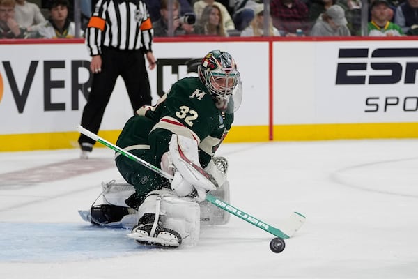 Minnesota Wild goaltender Filip Gustavsson (32) defends against a shot during the second period of Game 3 of a first-round NHL hockey playoff series against the Vegas Golden Knights, Thursday, April 24, 2025, in St. Paul, Minn. (AP Photo/Abbie Parr)