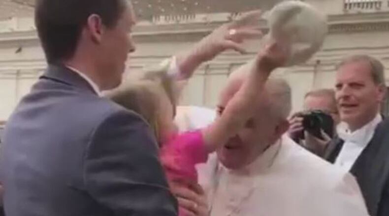 Estella Westrick, 3, snatched the skullcap off of Pope Francis’ head. (Credit: Twitter)