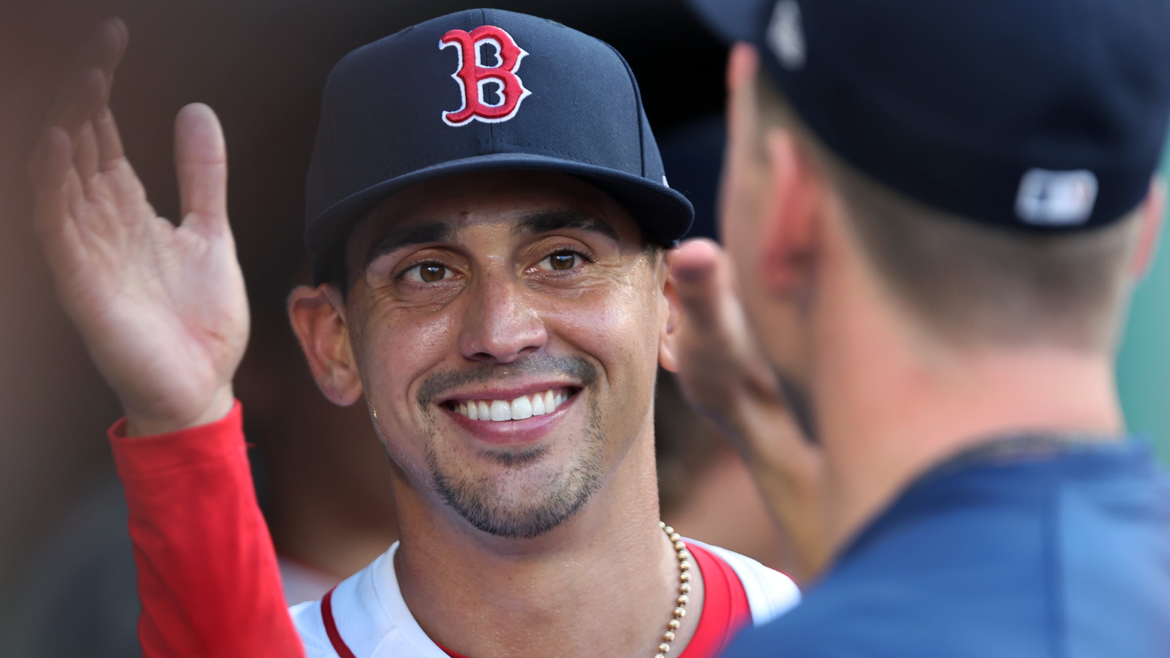 Boston Red Sox starting pitcher Jose De Leon smiles as he is greeted by teammates in the dugout after being removed in the top of the seventh inning during a baseball game against the Detroit Tigers, Sunday, Sept. 28, 2025, in Boston. (AP Photo/Jim Davis)