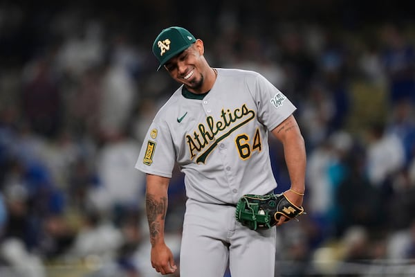 Athletics' Jhonny Pereda reacts after striking out Los Angeles Dodgers' Shohei Ohtani during the eighth inning of a baseball game Thursday, May 15, 2025, in Los Angeles. (AP Photo/Mark J. Terrill)