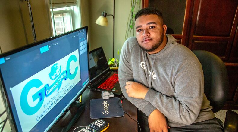 Earl McLendon poses for a photograph in his study area at his Lawrenceville home on Feb. 26, 2021.  (STEVE SCHAEFER FOR THE ATLANTA JOURNAL-CONSTITUTION)