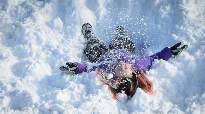Kids (and some adults) love eating snow. But should you? (Glen Stubbe/Minneapolis Star Tribune/TNS)