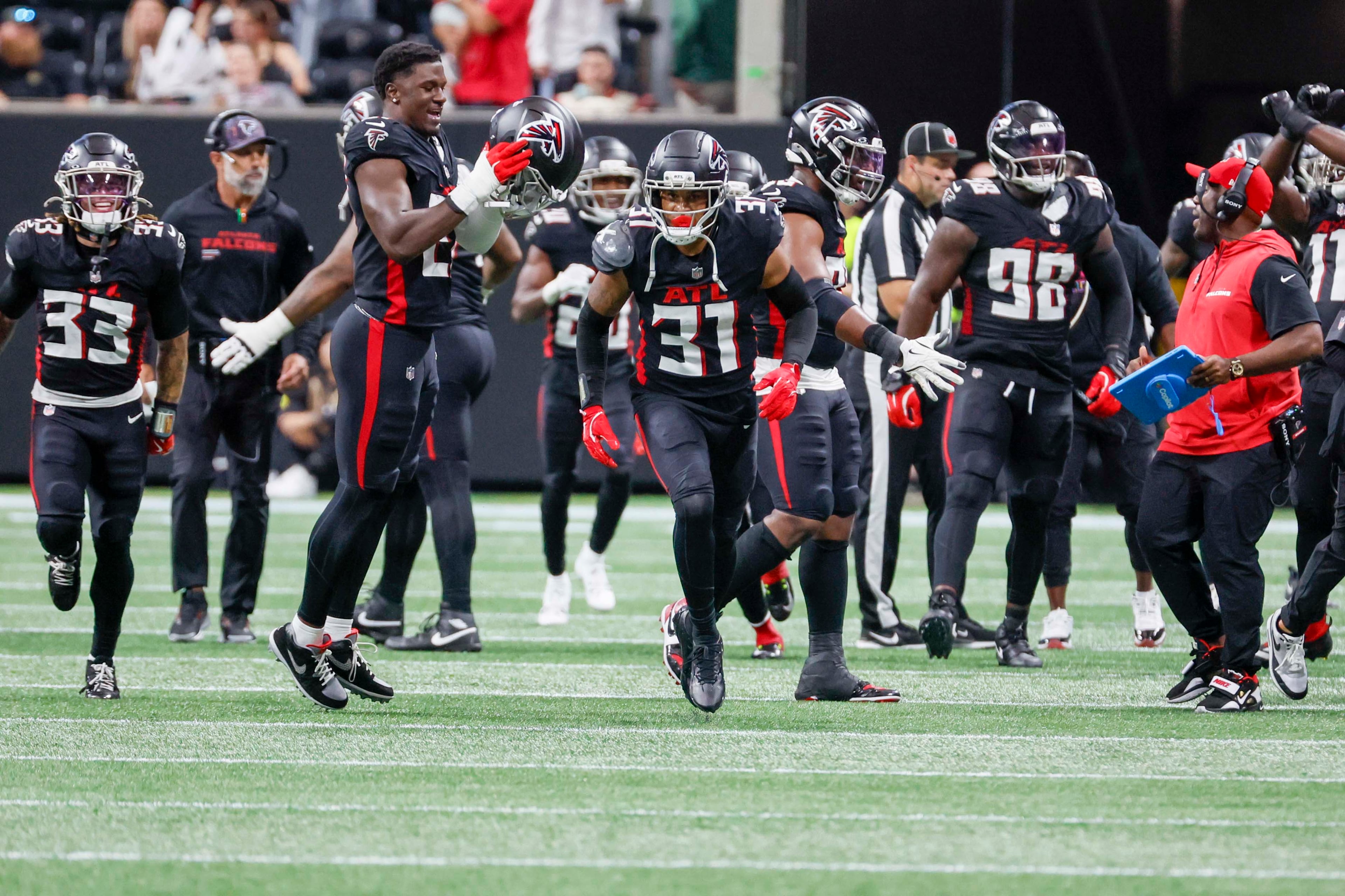 Atlanta Falcons safety Xavier Watts, center, celebrates with teammates after his interception during the second half of an NFL game against the Washington Commanders at Mercedes-Benz Stadium in Atlanta on Sunday, September 28, 2025.
(Miguel Martinez/AJC)