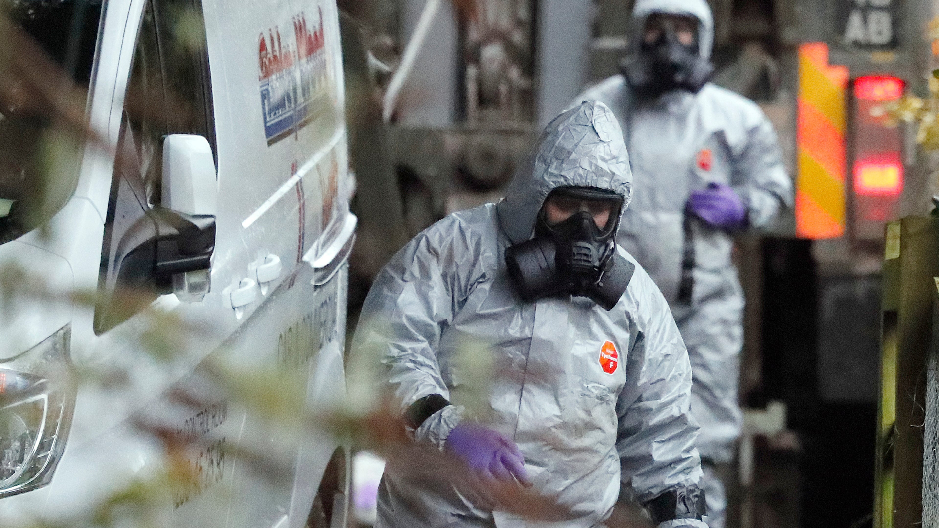 FILE - Personnel in protective gear work on a van in Winterslow, England, March 12, 2018, as investigations continue into the nerve-agent poisoning of former Russian intelligence officer Sergei Skripal and his daughter Yulia. (AP Photo/Frank Augstein, File)