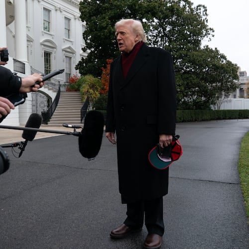 President Donald Trump talks to reporters as he departs from the South Lawn of the White House, Saturday, Nov. 22, 2025, in Washington, en route to Joint Base Andrews. (AP Photo/Jose Luis Magana)
