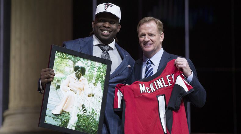 Takkarist McKinley (UCLA) poses with NFL commissioner Roger Goodell as he holds a photo of his grandmother as he is selected as the number 26 overall pick to the Atlanta Falcons in the first round the 2017 NFL Draft at the Philadelphia Museum of Art.