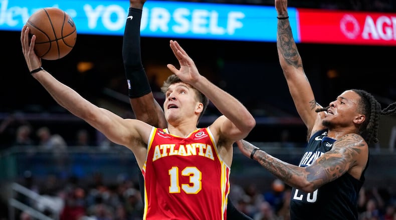 With Dejounte Murray, John Collins and Clint Capela sidelined, the Hawks have had to navigate the last eight games without some of their top leaders. So when Bogdan Bogdanovic returned to action two weeks ago, the Hawks welcomed his shooting – and his voice. (AP Photo/John Raoux)