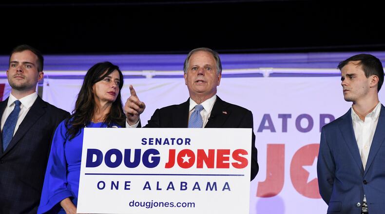 FILE - Sen. Doug Jones delivers his concession speech surrounded by family during his election night watch party, Nov. 3, 2020, in Birmingham, Ala. (AP Photo/Julie Bennett, File)