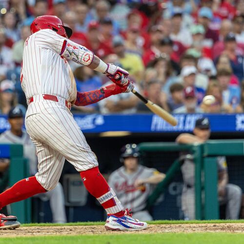 Philadelphia Phillies designated hitter Kyle Schwarber hits a solo home run during the fourth inning of a baseball game against the Atlanta Braves, Saturday, Sept. 5, 2026, in Philadelphia. (AP Photo/Laurence Kesterson)