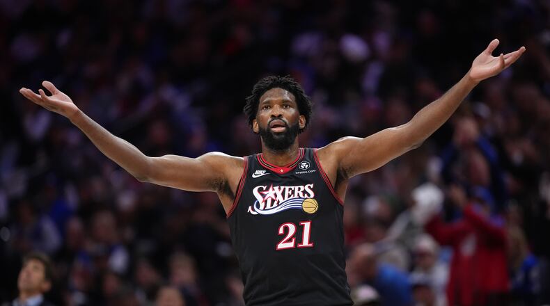Philadelphia 76ers' Joel Embiid reacts during the first half of Game 4 against the Boston Celtics in a first-round NBA basketball playoffs series Sunday, April 26, 2026, in Philadelphia. (AP Photo/Matt Slocum)