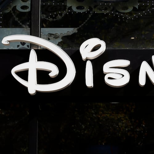 FILE - The Disney logo is seen on their store along the Champs Elysees Avenue in Paris on Sept. 20, 2017. (AP Photo/Francois Mori, File)