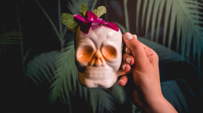 Potent drinks in exotic mugs await at S.O.S. Tiki Bar.