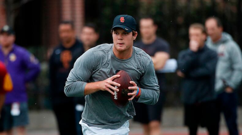 FILE - In this March 21, 2018, file photo, Southern California quarterback Sam Darnold looks to throw a pass during USC Pro Day in Los Angeles. Darnold is visiting the Cleveland Browns, Wednesday, April 4, 2018, who are spending the week meeting with quarterbacks to potentially draft No. 1 overall. (AP Photo/Jae C. Hong, File)
