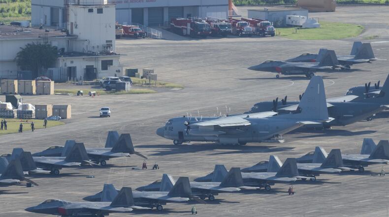 U.S. military aircraft are parked on the tarmac at Jose Aponte de la Torre Airport in Ceiba, Puerto Rico, Saturday, Jan. 3, 2025. (AP Photo/Alejandro Granadillo)