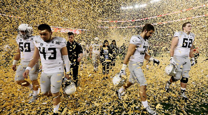 AP10ThingsToSee - Oregon players walk off the field after losing to Ohio State, 42-20, in the NCAA college football playoff championship game, Monday, Jan. 12, 2015, in Arlington, Texas. (AP Photo/Brandon Wade)