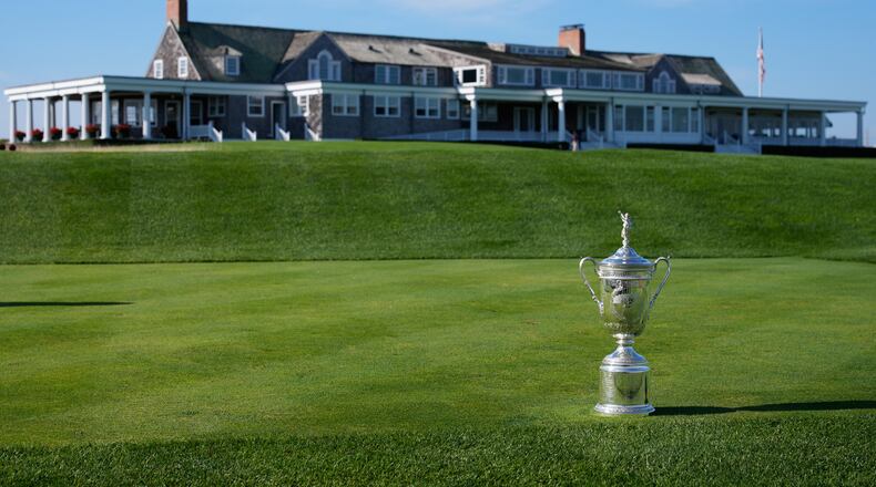 FILE - The U.S. Open Golf Championship trophy is displayed in front of the clubhouse at Shinnecock Hills Golf Club in Southampton, N.Y., Sept. 15, 2025. (AP Photo/Seth Wenig, File)