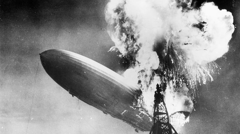 The Hindenburg disaster at Lakehurst, New Jersey, which marked the end of the era of passenger-carrying airships. The zeppelin burst into flames on May 6, 1937.