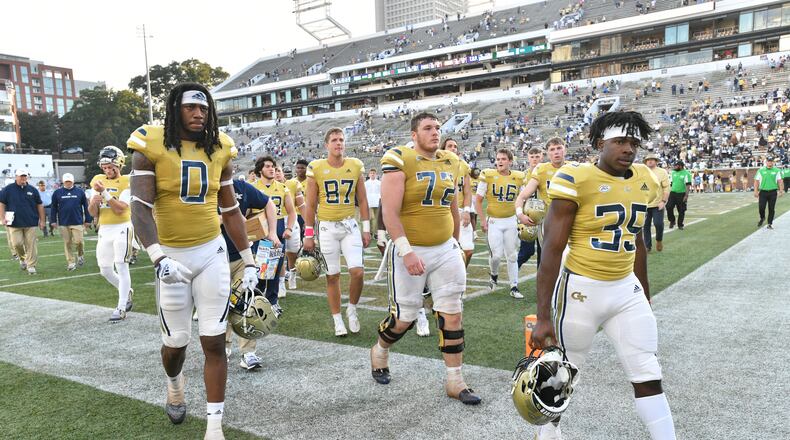 Georgia Tech players leave the football field after Ole Miss defeat Georgia Tech in an NCAA college football game at Georgia Tech's Bobby Dodd Stadium in Atlanta on Saturday, September 17, 2022. Ole Miss won 42-0 over Georgia Tech. (Hyosub Shin / Hyosub.Shin@ajc.com)