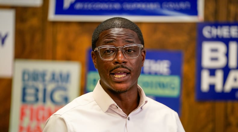 David Crowley, Democratic candidate for Wisconsin governor speaks to supporters gathered at the Sheboygan County Democratic Party office during a campaign stop Friday, Aug. 7, 2026, in Sheboygan, Wis. (AP Photo/Kayla Wolf)
