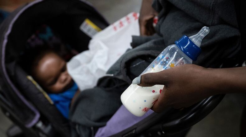 A mother looks for baby formula in a supermarket in Washington, D.C. in May 2022. (BRENDAN SMIALOWSKI/AFP/GETTY IMAGES)
