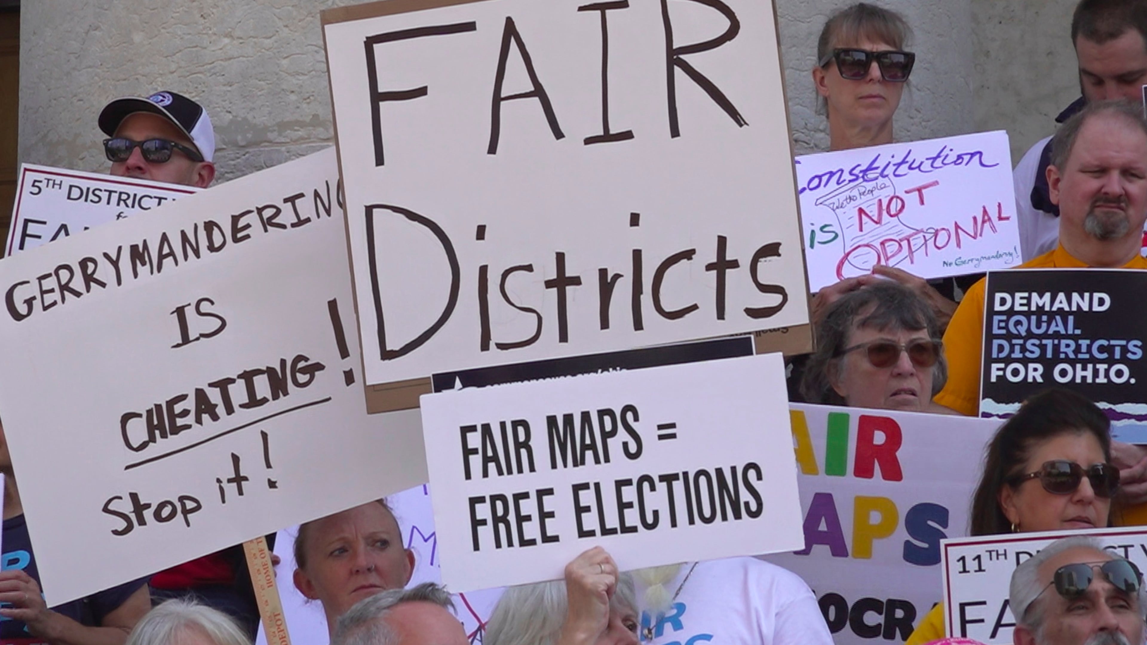 This photo taken from video shows organizers rallying outside of the Ohio Statehouseto protest gerrymandering and advocate for lawmakers to draw fair maps on Wednesday, Sept. 17, 2025, in Columbus, Ohio. (AP Photo/Patrick Aftoora-Orsagos)