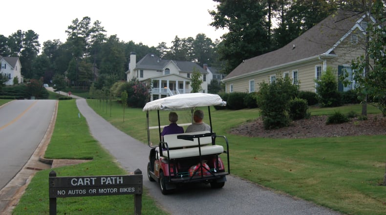 A golf cart serves as transportation of choice for local trips around Peachtree City. Photo taken in Planterra Ridge neighborhood. (JANNELLE MIMMS/ Special)