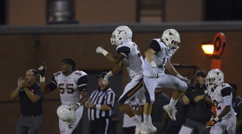 Kell junior FS Nicholas Ross (left) and junior WR Sam Blancato (right) react to a turnover in the second half of their game at East Paulding Friday, September 29, 2017. Special/Daniel Varnado