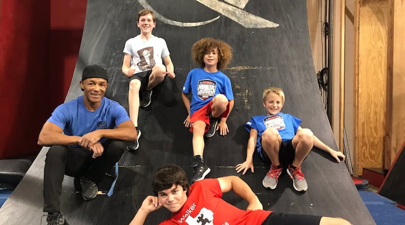 Several participants in the new show "American Ninja Warrior Junior." (L-R Ninja Quest owner Glenn Davis, Brooks Bebe, Vanc Walker (bottom), Luke Milman and Tate Allen CREDIT: Rodney Ho/rho@ajc.com