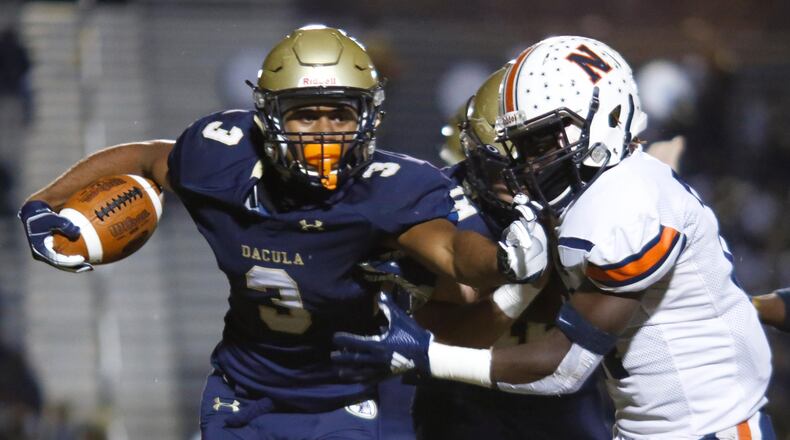 Dacula's Jalen Perry (3) pushes away a Northside defender during the first half of Friday's Class AAAAAA semifinal in Dacula. (Casey Sykes/Special)