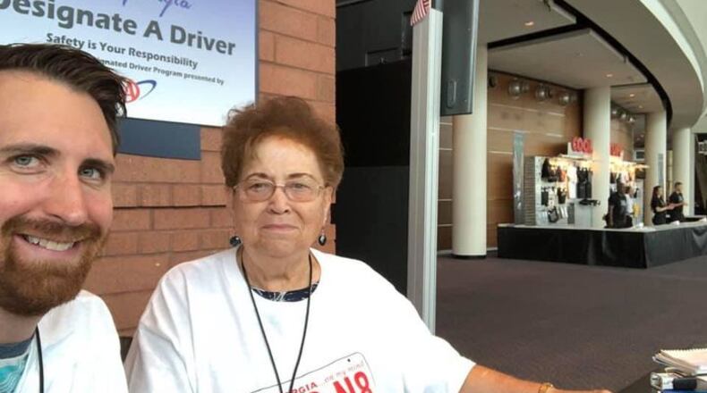 A.	Doug Turnbull and Sandy Kinnard (right) work the TEAM Georgia booth at a 2018 event at the Infinite Energy center