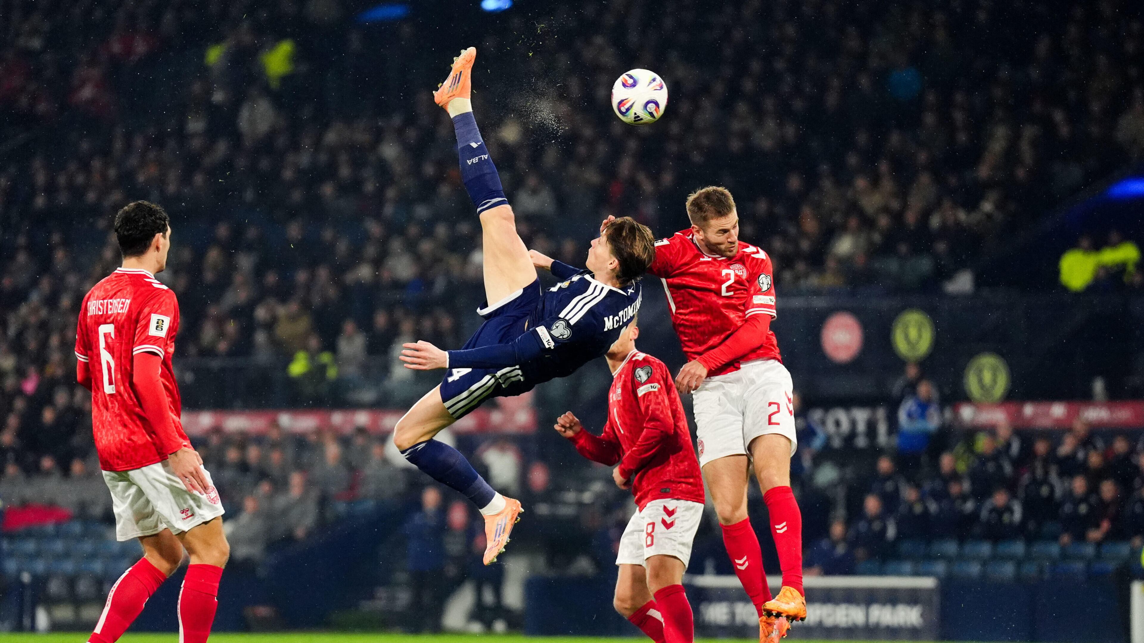 Scotland's Scott McTominay scores the opening goal with an overhead kick during the 2026 World Cup European Qualifying soccer match between Scotland and Denmark at Hampden Park, Glasgow, Scotland, Tuesday, Nov. 18, 2025. (Andrew Milligan/PA via AP)