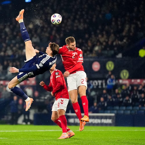 Scotland's Scott McTominay scores the opening goal with an overhead kick during the 2026 World Cup European Qualifying soccer match between Scotland and Denmark at Hampden Park, Glasgow, Scotland, Tuesday, Nov. 18, 2025. (Andrew Milligan/PA via AP)