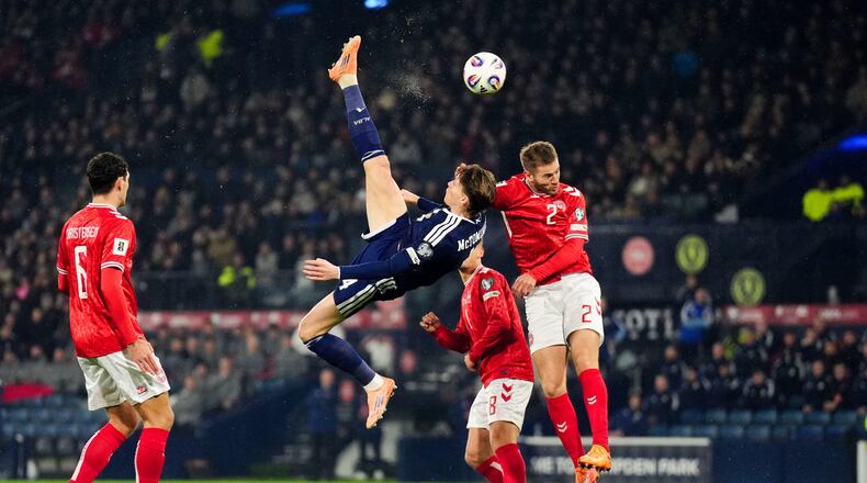 Scotland's Scott McTominay scores the opening goal with an overhead kick during the 2026 World Cup European Qualifying soccer match between Scotland and Denmark at Hampden Park, Glasgow, Scotland, Tuesday, Nov. 18, 2025. (Andrew Milligan/PA via AP)