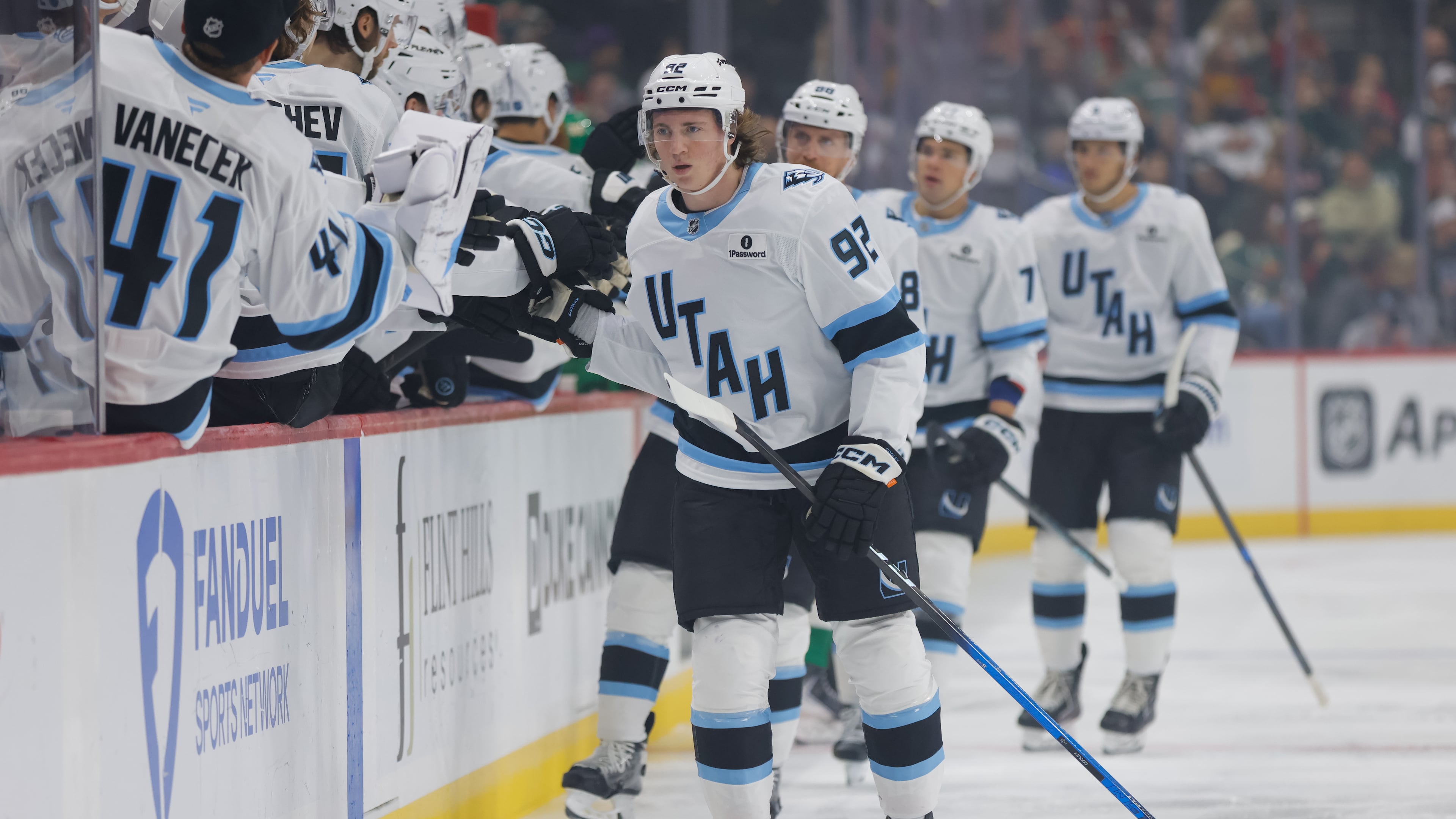Utah Mammoth center Logan Cooley (92) is congratulated after scoring during the first period of an NHL hockey game against the Minnesota Wild, Saturday, Oct. 25, 2025, in St. Paul, Minn. (AP Photo/Bailey Hillesheim)