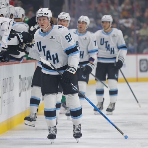 Utah Mammoth center Logan Cooley (92) is congratulated after scoring during the first period of an NHL hockey game against the Minnesota Wild, Saturday, Oct. 25, 2025, in St. Paul, Minn. (AP Photo/Bailey Hillesheim)