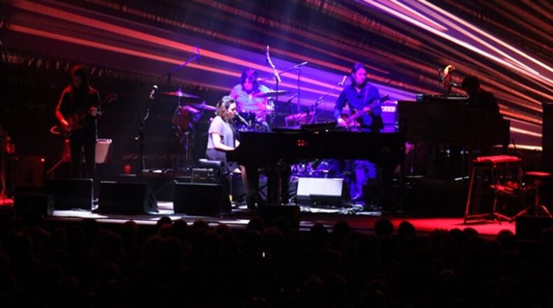 Norah Jones and her band spotlighted by a burst of color at the Fox Theatre. Photo: Melissa Ruggieri/AJC