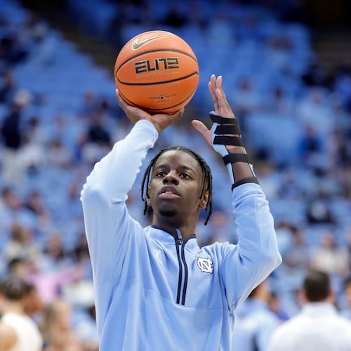 North Carolina forward Caleb Wilson, with his left arm in a medical brace and not playing in the game, shoots during warm-ups before an NCAA college basketball game against Pittsburgh, Saturday, Feb. 14, 2026, in Chapel Hill, N.C. (AP Photo/Chris Seward)