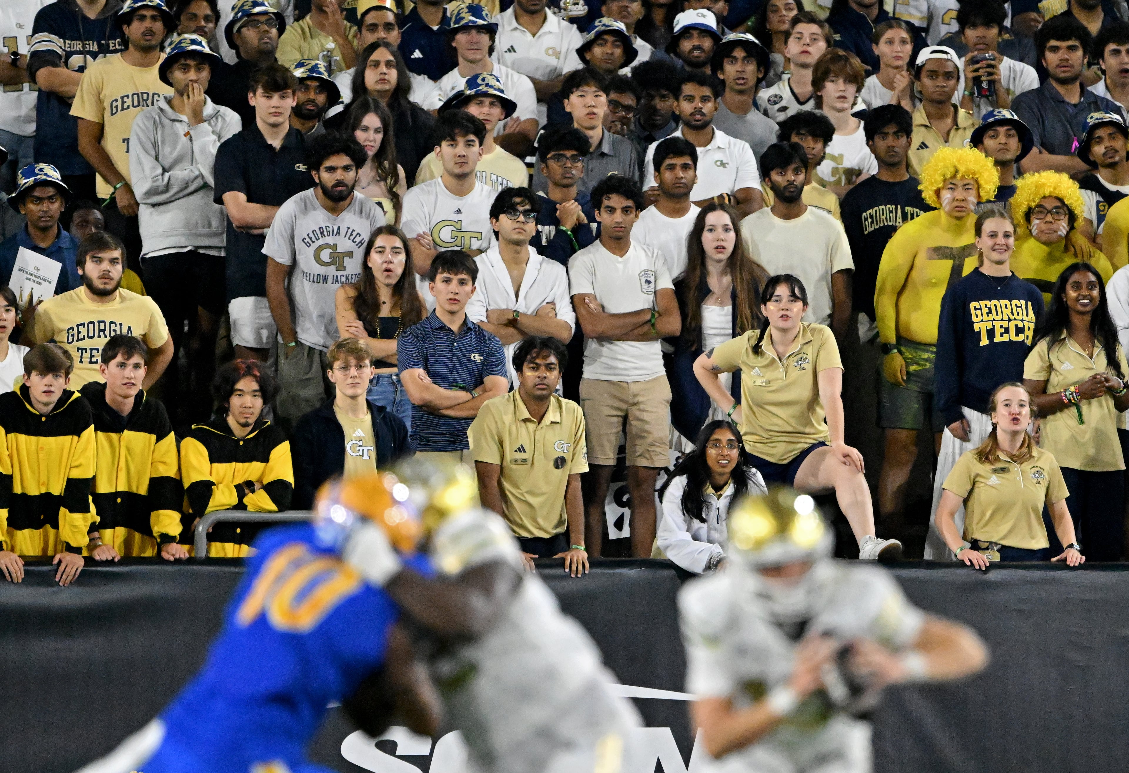 Georgia Tech fans watch as quarterback Haynes King (foreground right) runs the ball during the second half in an NCAA college football game at Bobby Dodd Stadium, Saturday, November 22, 2025 in Atlanta. Pittsburgh won 42-28 over Georgia Tech. (Hyosub Shin / AJC)