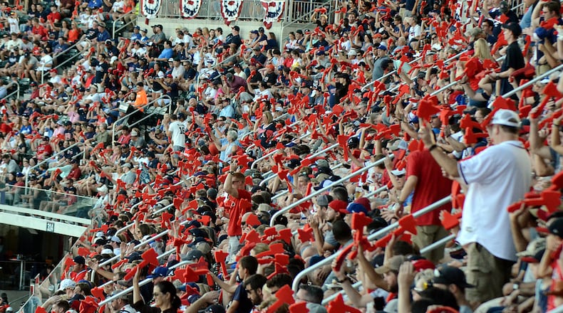 Braves fans wave red styrofoam tomahawks in unison on Monday, Oct. 8, 2018. Mitchell Northam/AJC