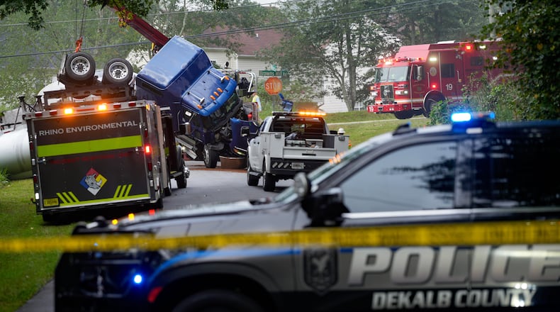 Parts of Browns Mill Road near White Circle are shut down in both directions on Friday, Aug. 28, 2026, as authorities address the overturned tanker truck. (Ben Hendren for the AJC)