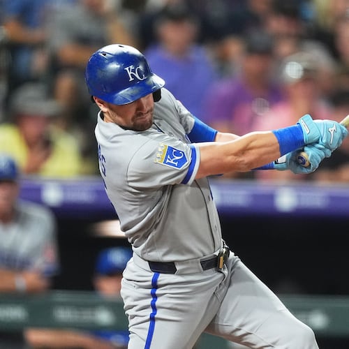Kansas City Royals' Lane Thomas singles off Colorado Rockies starting pitcher Tomoyuki Sugano in the sixth inning of a baseball game Friday, July 31, 2026, in Denver. (AP Photo/David Zalubowski)