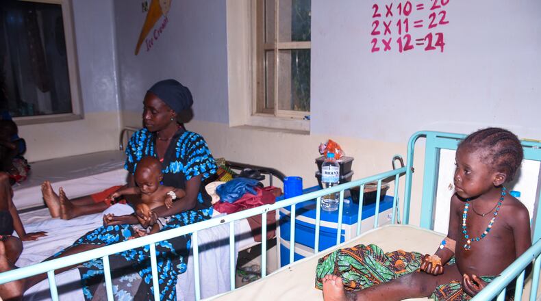 Women and children who were rescued after being held in a forest after they were abducted from the Woro community by gunmen in February receive medical attention at a hospital in Ilorin, Nigeria, Friday, Aug. 7, 2026. (AP Photo/Abubakar Khadijat)