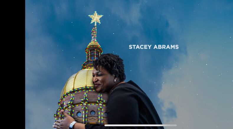 A Republican Governors Association attack ad features an image of Stacey Abrams embracing the Gold Dome.