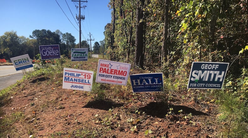 These were some of the 57 campaign signs bordering the East Roswell Library, on Wednesday, Oct. 23, 2019. The library is one of the city’s two early voting locations. Election day is Nov. 5, 2019. (Ben Brasch/AJC)