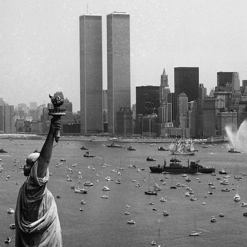 FILE - Ships participate in Operation Sail between the Statue of Liberty and the World Trade Center to celebrate the U.S. bicentennial in New York on July 4, 1976. (AP Photo/Eddie Adams, File)