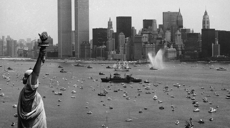 FILE - Ships participate in Operation Sail between the Statue of Liberty and the World Trade Center to celebrate the U.S. bicentennial in New York on July 4, 1976. (AP Photo/Eddie Adams, File)