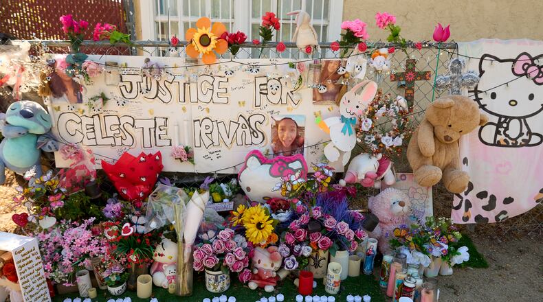 A makeshift Memorial for Celeste Rivas Hernandez, who was killed and found inside a vehicle owned by singer D4vd, is placed outside her home in Lake Elsinore, Calif., on Tuesday, April 21, 2026. (AP Photo/Damian Dovarganes)