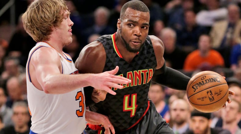 Atlanta Hawks’ Paul Millsap, right, pushes past New York Knicks’ Ron Baker during the second half of the NBA basketball game, Monday, Jan. 16, 2017 in New York. The Hawks defeated the Knicks 108-107. (AP Photo/Seth Wenig)