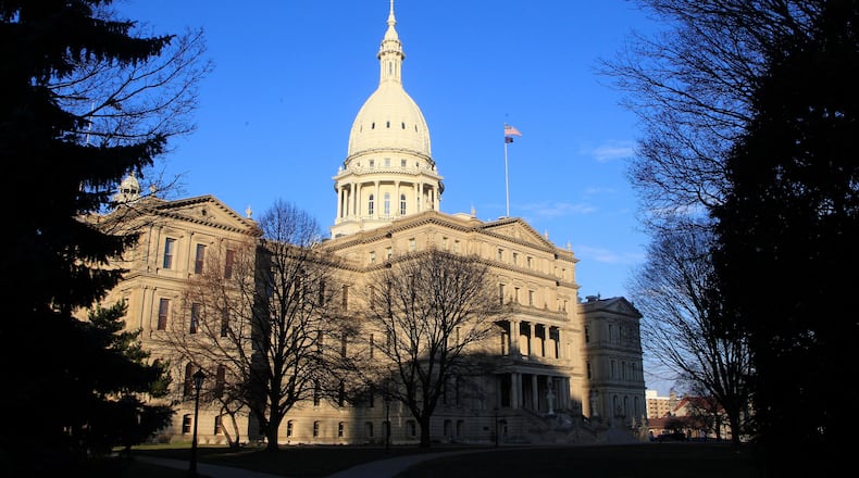 FILE - The state Capitol building is seen on Dec. 12, 2012, in Lansing, Mich. (AP Photo/Carlos Osorio, File)
